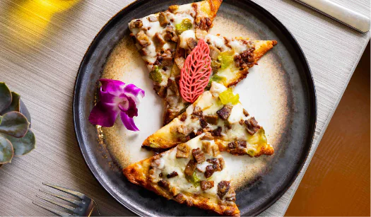 Flatbread piyya with herbs and flowers.