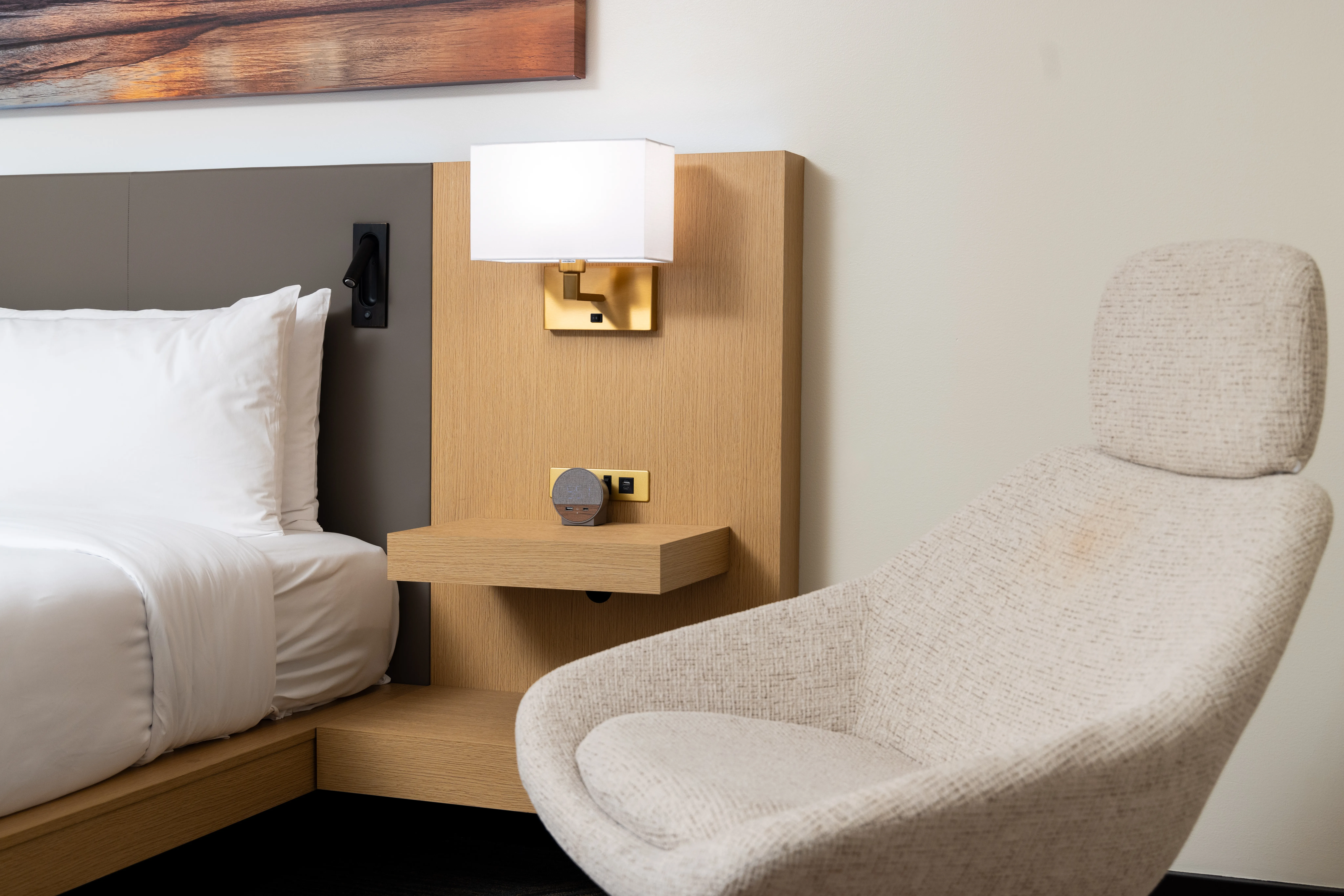 Bed, chair and lamp.