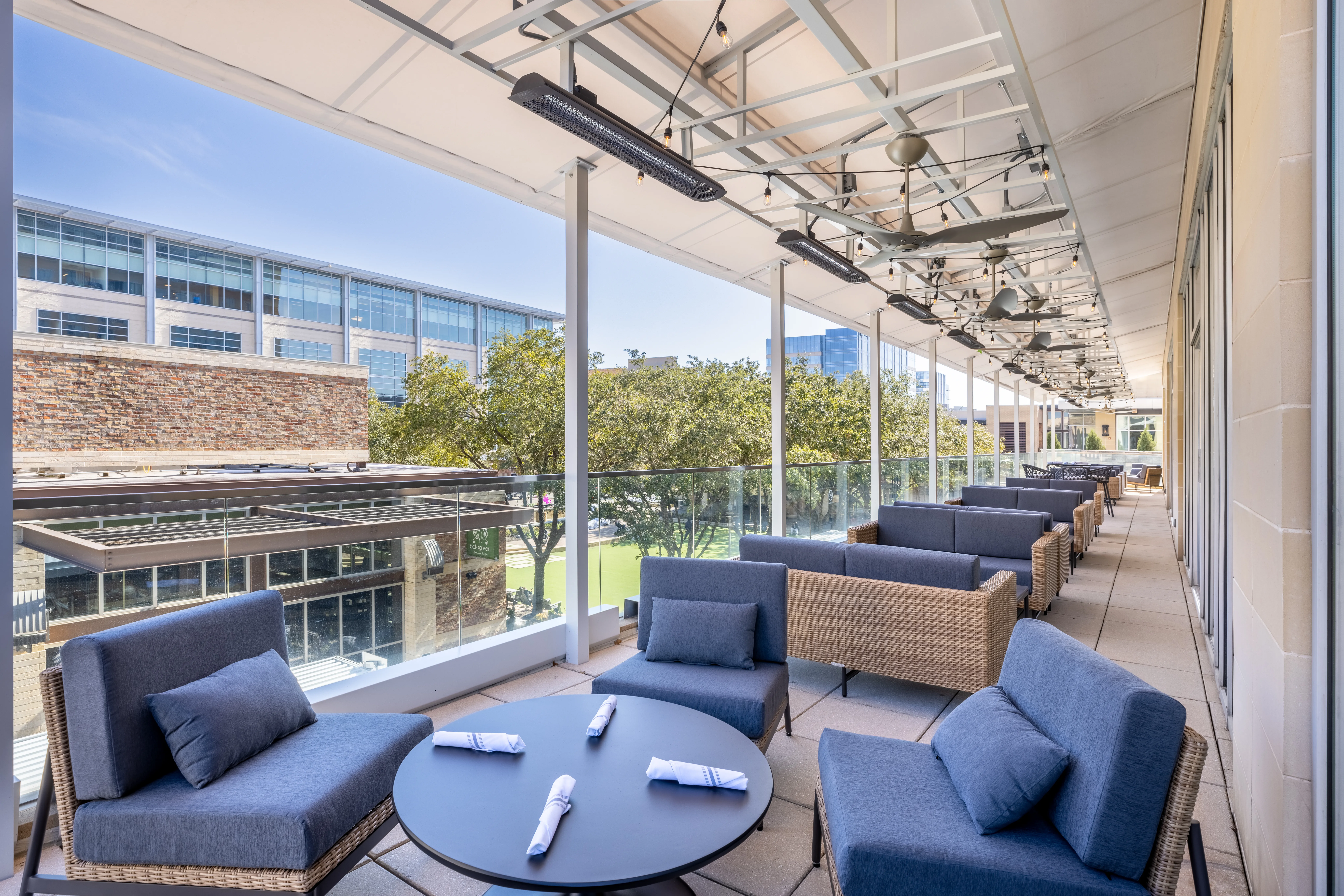 Outdoor terrace with round tables.