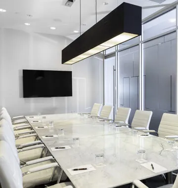 Meeting room with chairs and screen.