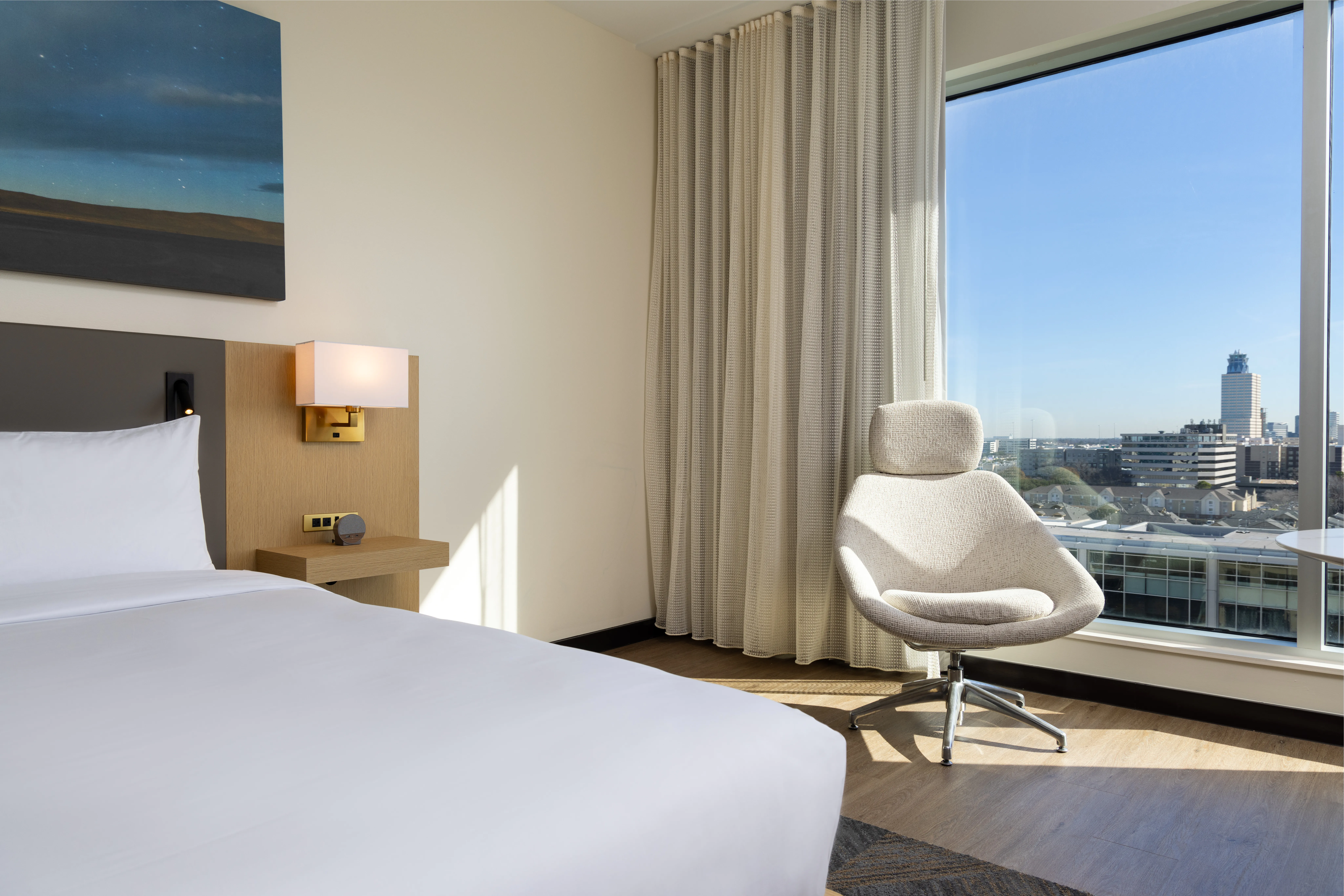 Bed and outside view in guest room
